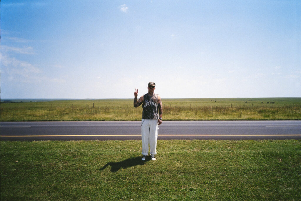 Rootbeer Richie standing alone in a field